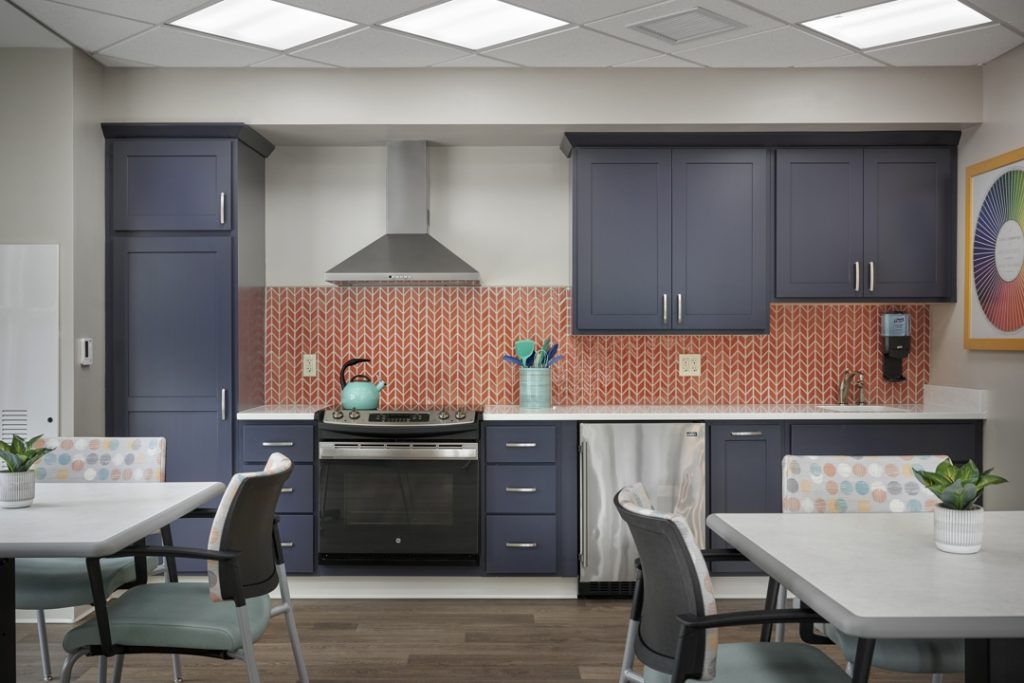 The new memory support residence features bold colors and distinctive finishes to create diverse living and activity spaces.