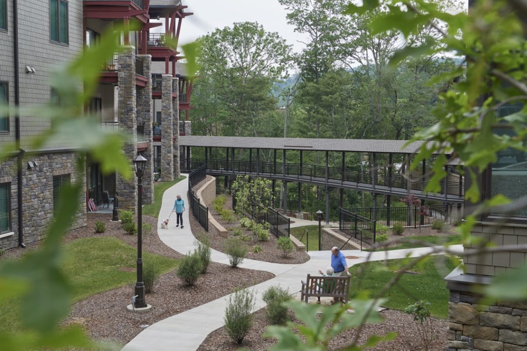 A 60-foot buffer of naturally occurring trees and plant life protects and frames the stream flowing through the middle of the Friendship Park neighborhood. 