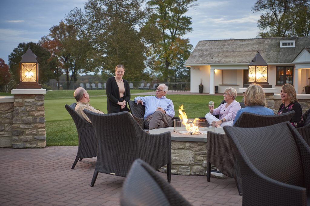 This area serves as an outdoor cocktail lounge offering a 180-degree view of the golf course.