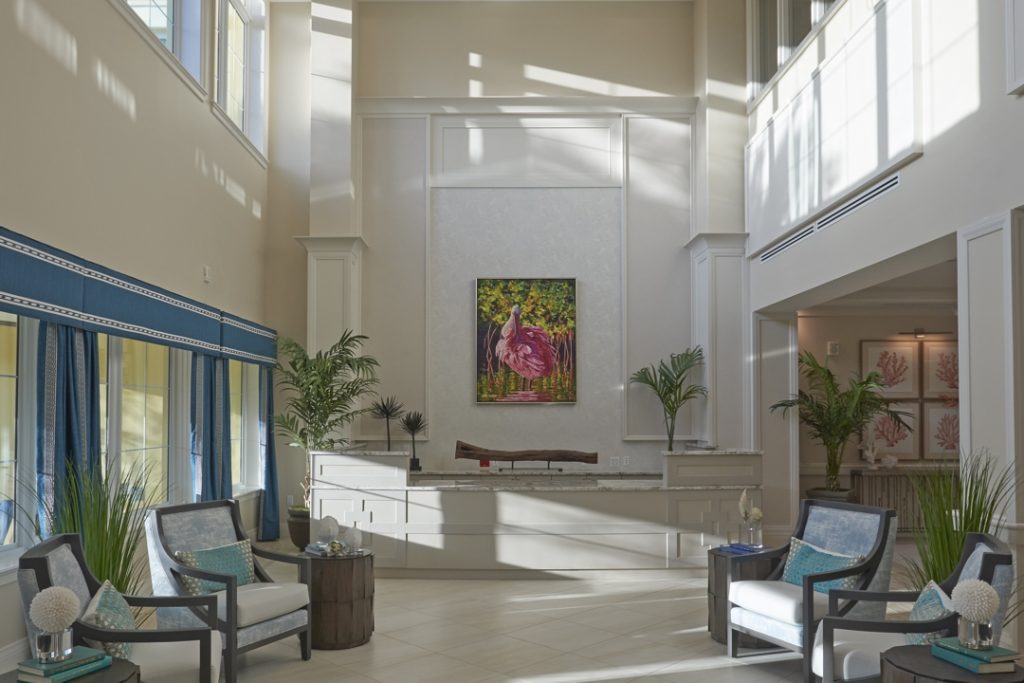 The bright two-story lobby space includes commissioned artwork by a local artists as the focal point.