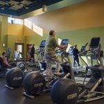 Exercise equipment room with lime green and bold yellow walls