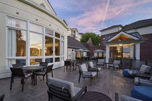 Blakeford at Green Hills outdoor dining patio with kitchen at dusk