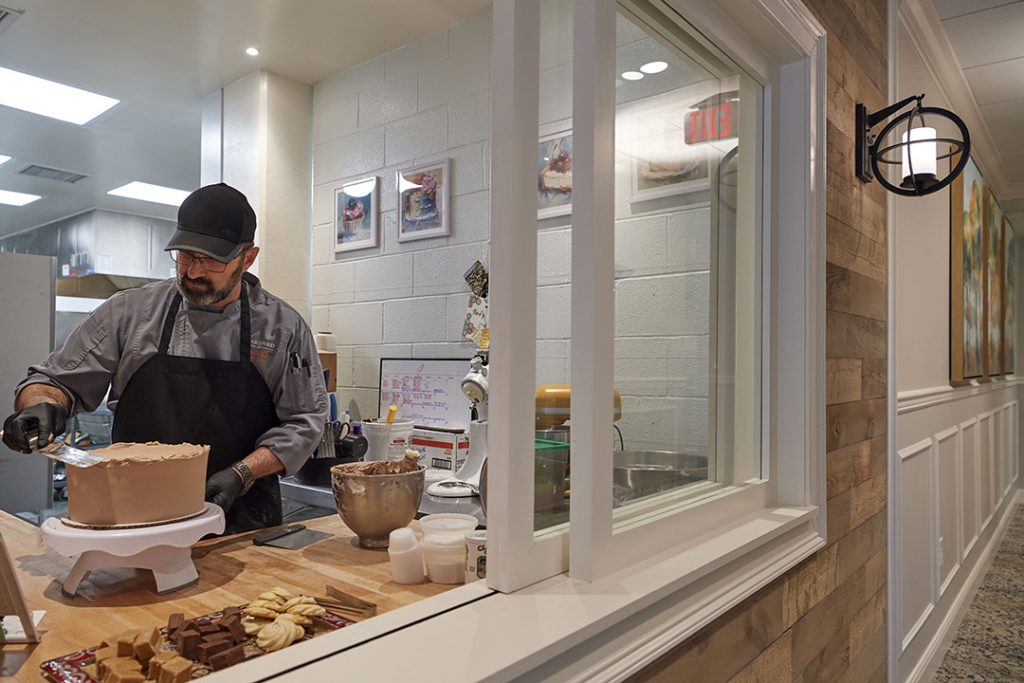 The popular bakery window draws people to chat or grab a treat on their way to or from assisted living and the commons. 