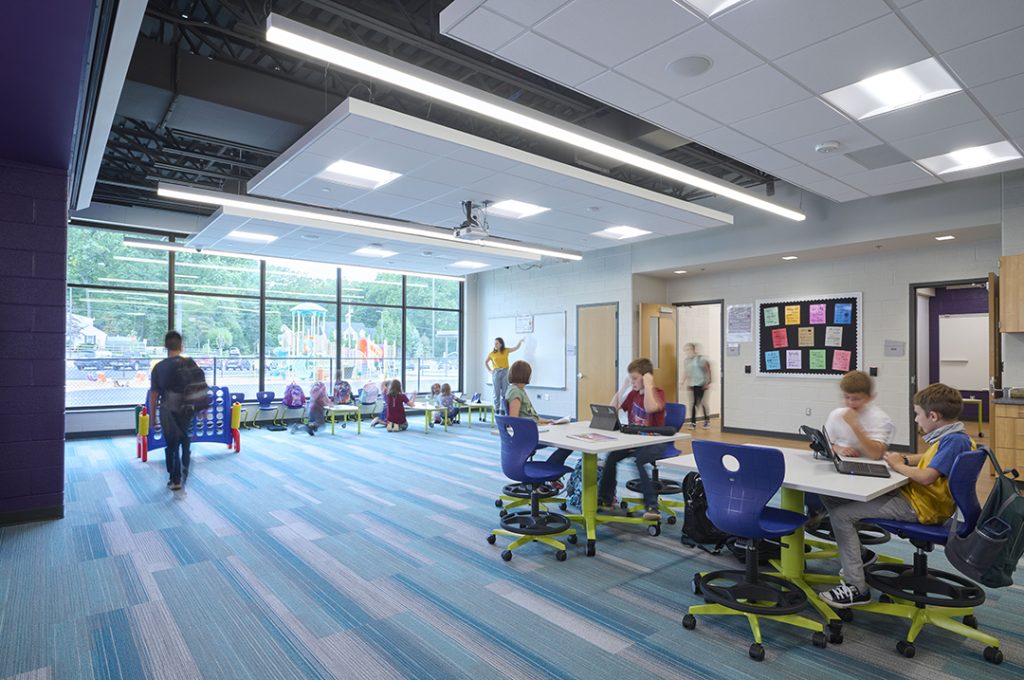 K12 SGI classroom with window wall and carpeting in shades of blue